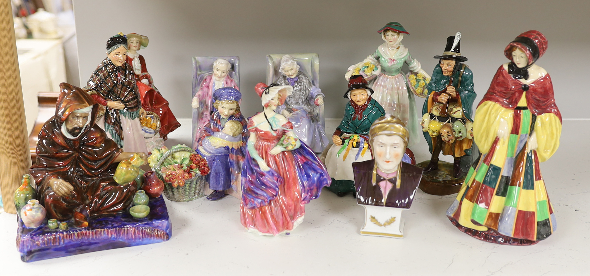 Eleven Royal Doulton porcelain figures including; The Potter HN1493, The Orange Lady HN1759, Daffy-Down-Dilly, etc. tallest 25cm, and a Continental porcelain bust (12)